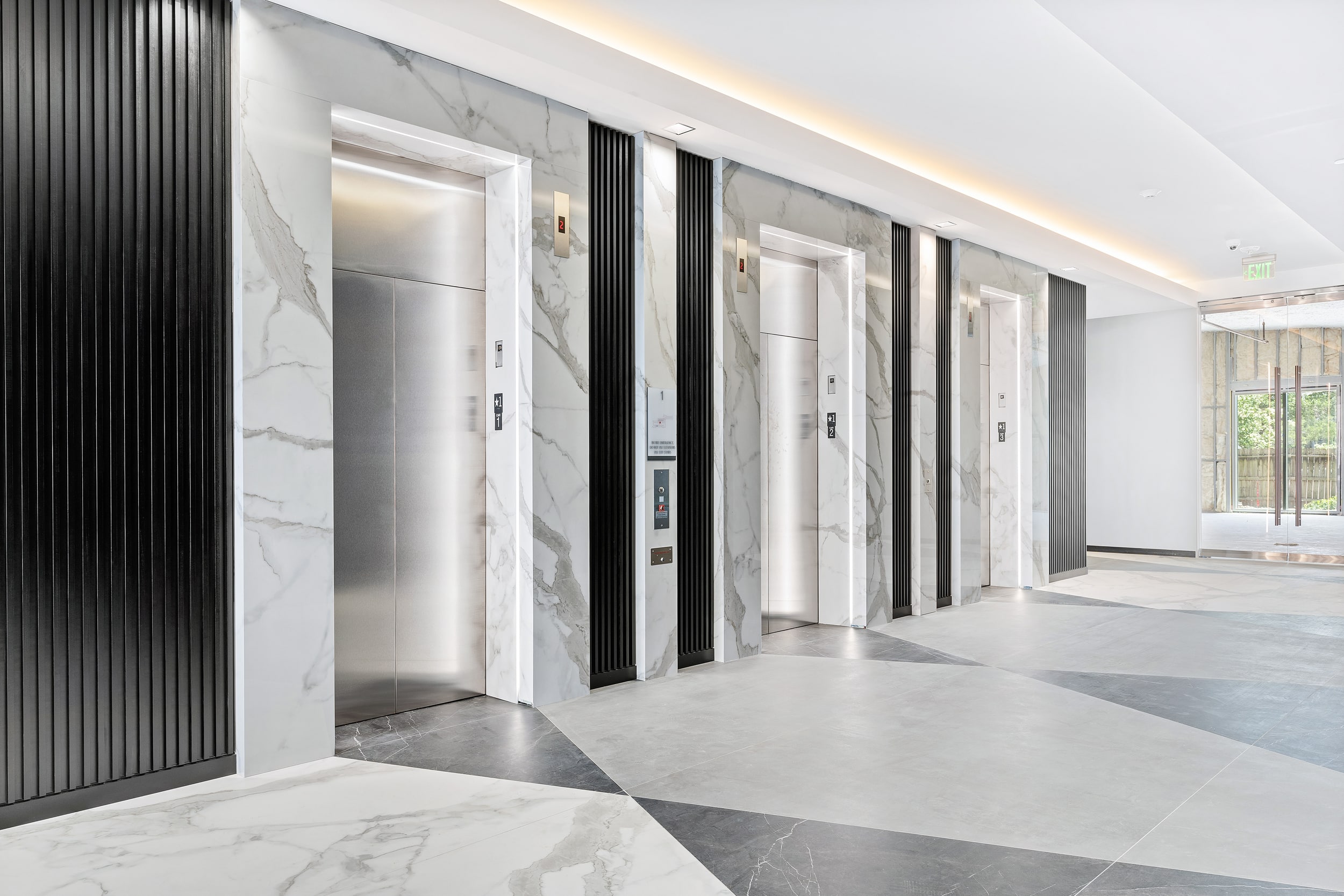 Porcelain Flooring and Elevators in White Classico & Pietra Gray