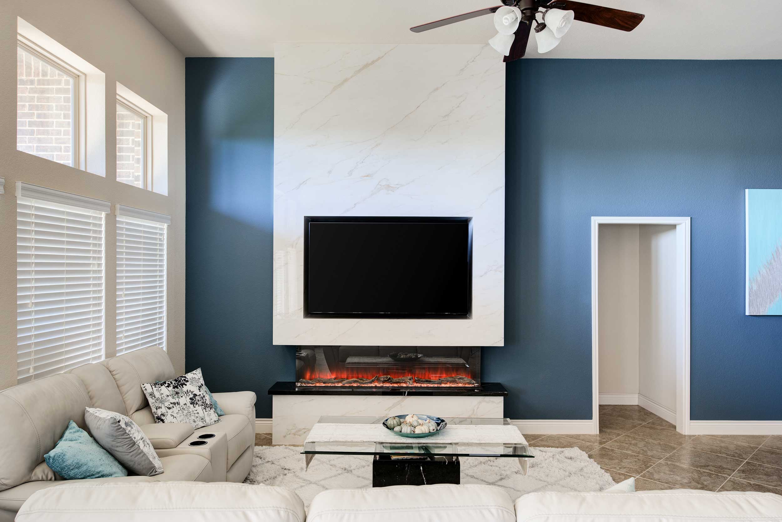 Large-format Porcelain Sintered Stone Fireplace Surround in Calacatta Oro and Black Marquina